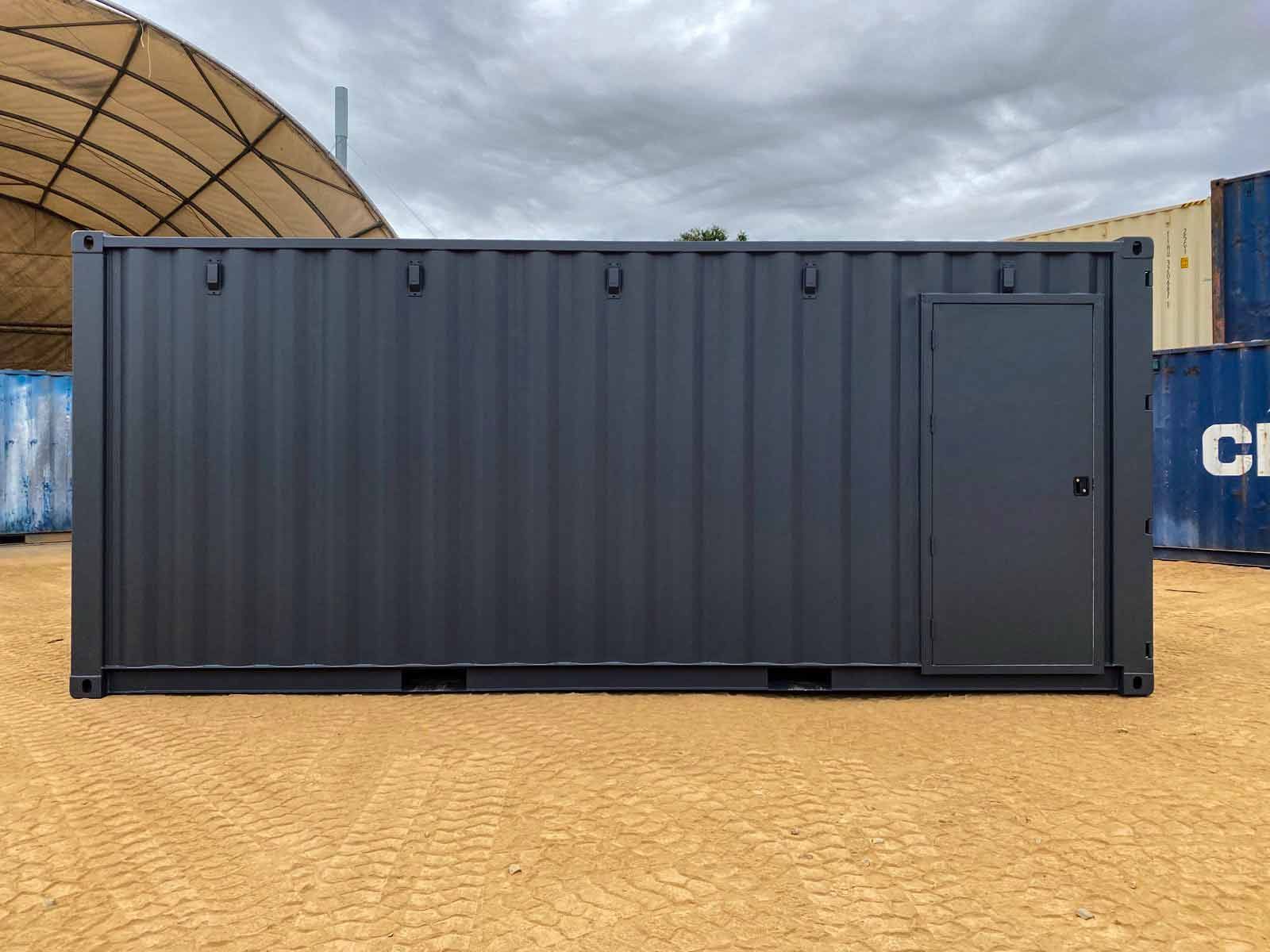 Black Shipping Container with Door on a Dirt Field — East Coast Containers Shipping Containers and Transport in Brisbane, QLD