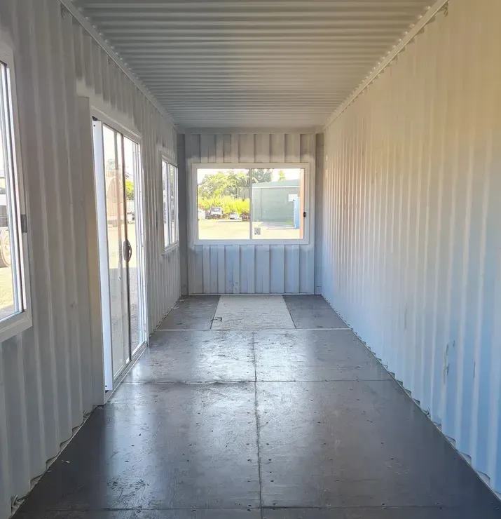 Long Empty Room with Many Windows and Doors — East Coast Containers Shipping Containers and Transport in Gold Coast, QLD
