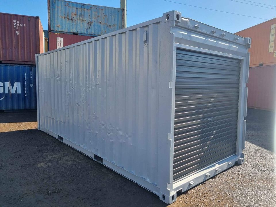 Shipping Container with Garage Door in Warehouse — East Coast Containers Shipping Containers and Transport in Chevallum, QLD