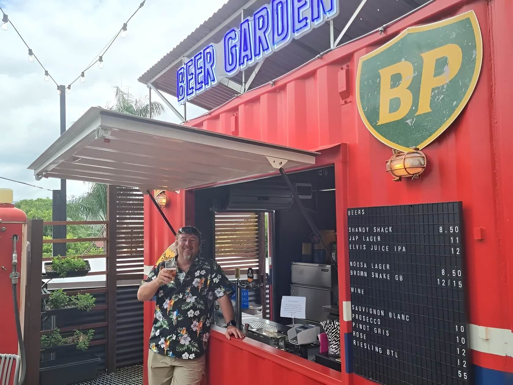 Man Standing in Front of Red BP Truck — East Coast Containers Shipping Containers and Transport in Sunshine Coast, QLD