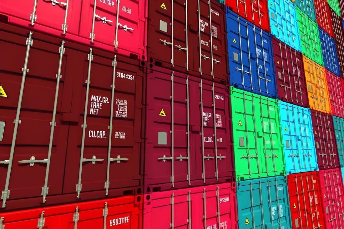 A number of colourfully stacked shipping containers