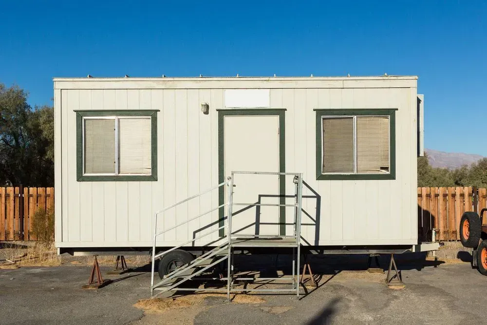 Small White Trailer with Stairs Leading Up to It — East Coast Containers Shipping Containers and Transport in Chevallum, QLD