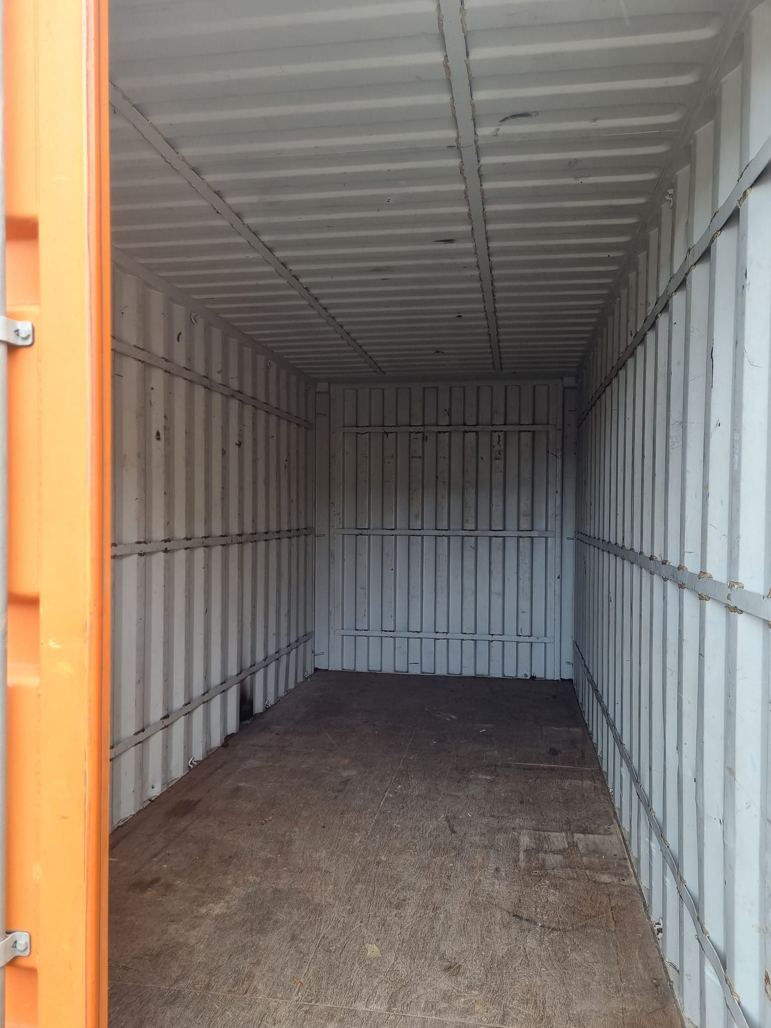 Interior of an Empty Orange and White Storage Container — East Coast Containers Shipping Containers and Transport in Chevallum, QLD