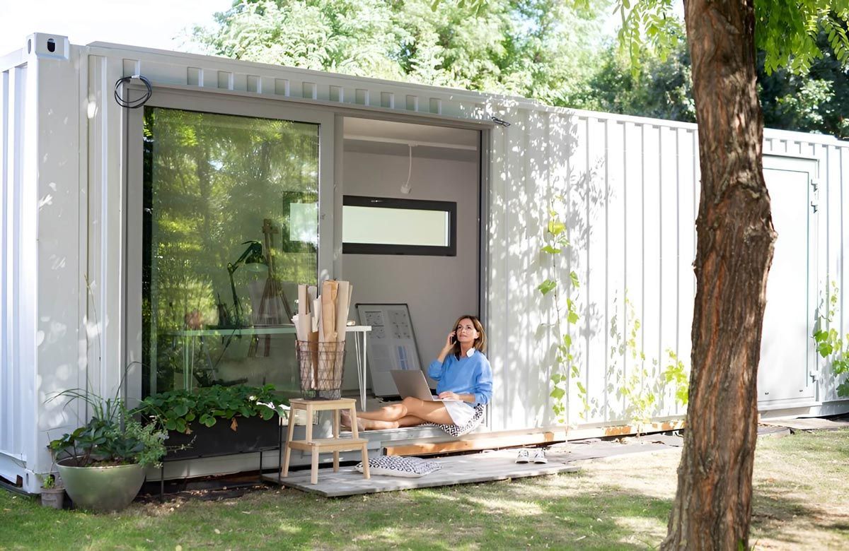 Woman Sitting on Porch in House Shipping Container — East Coast Containers Shipping Containers and Transport in Gympie, QLD