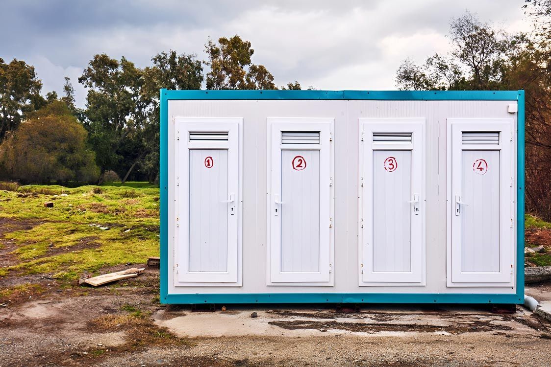 Portable Toilets in a Field with Trees — East Coast Containers Shipping Containers and Transport in Sunshine Coast, QLD