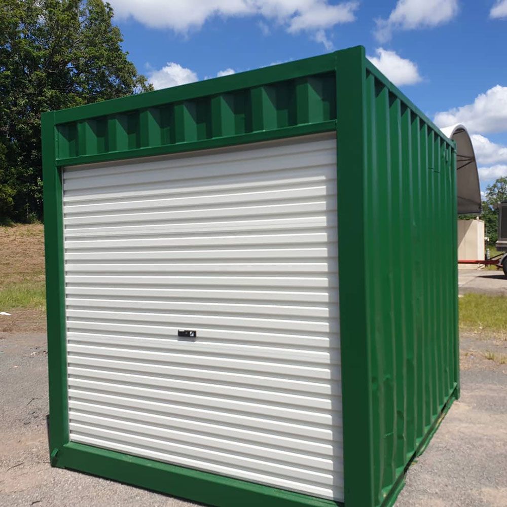 Green Building with White Garage Door — East Coast Containers Shipping Containers and Transport in Gold Coast, QLD