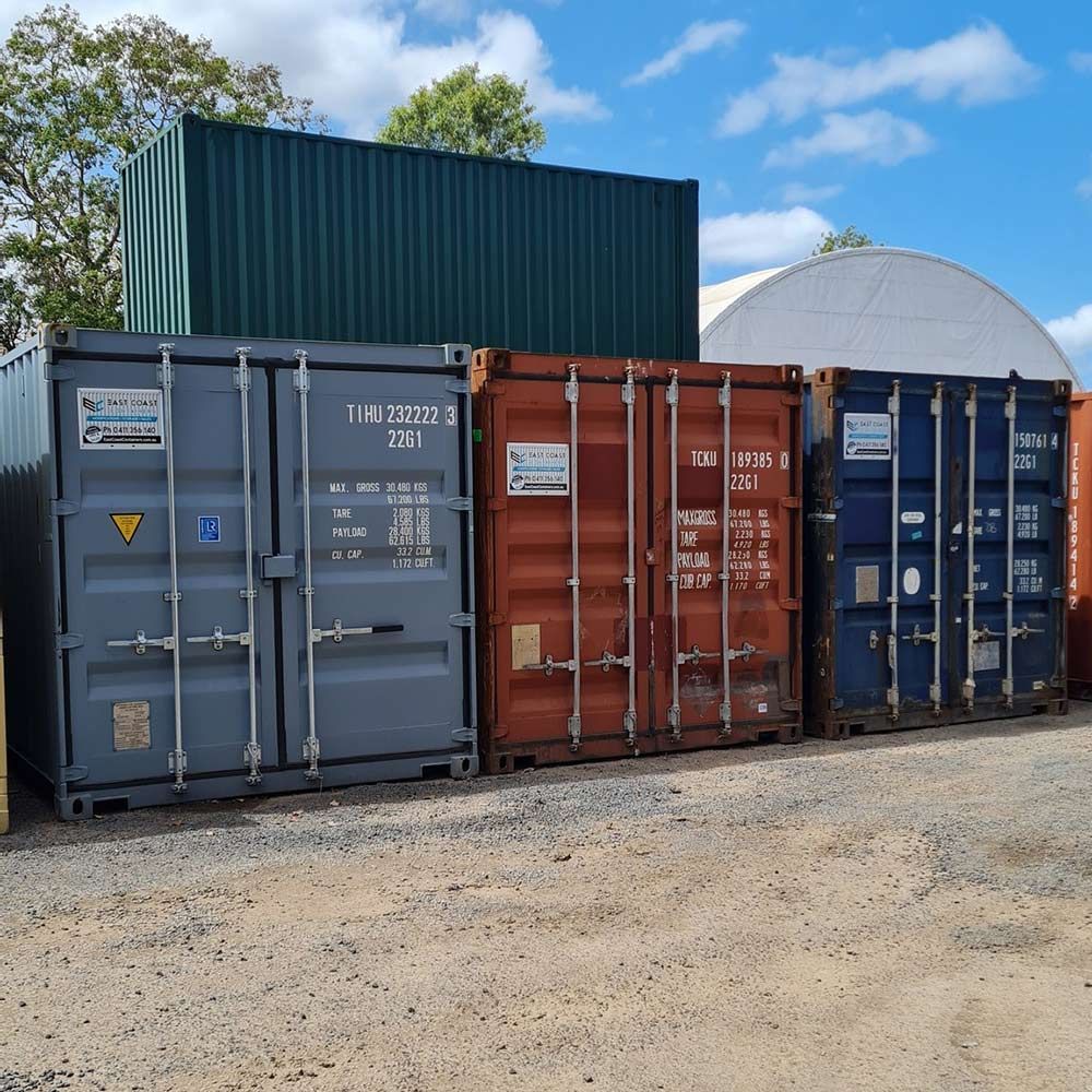 Shipping Containers Lined Up in Parking Lot — East Coast Containers Shipping Containers and Transport in Sunshine Coast, QLD