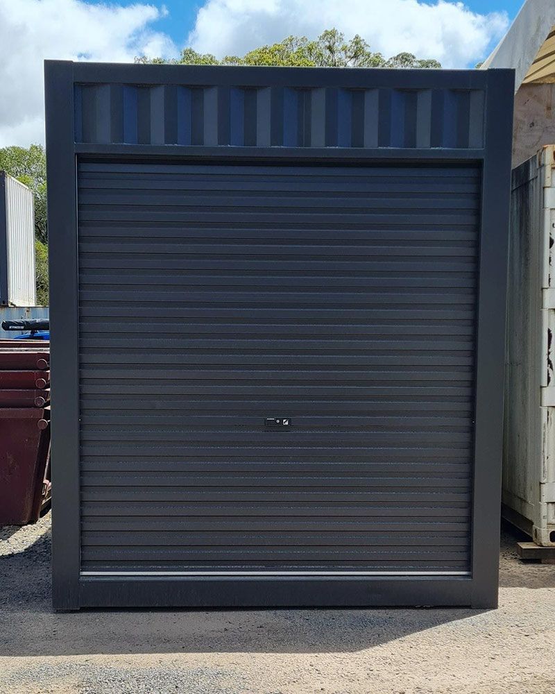 Black Garage Door on Gravel Road — East Coast Containers Shipping Containers and Transport in Chevallum, QLD