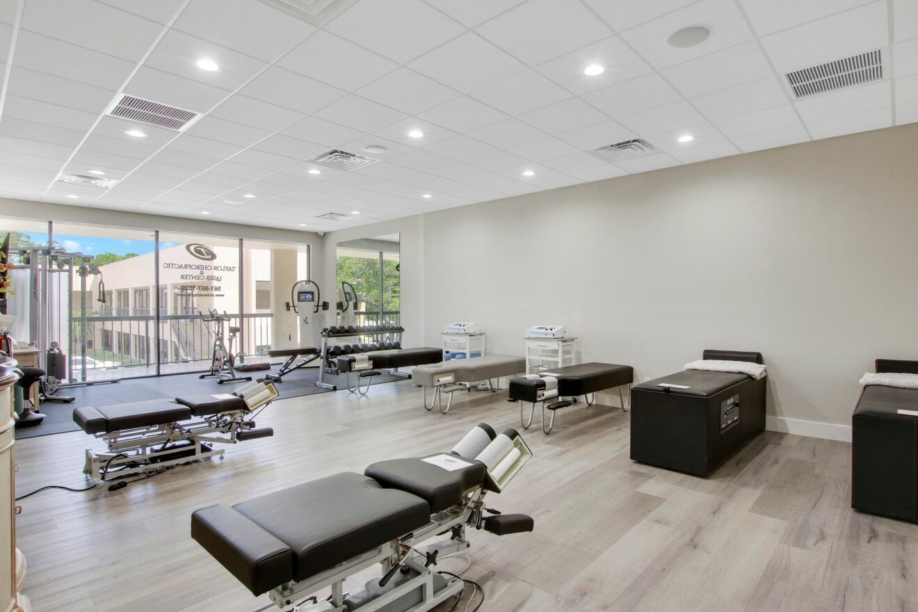 A large room with a lot of tables and chairs in it.