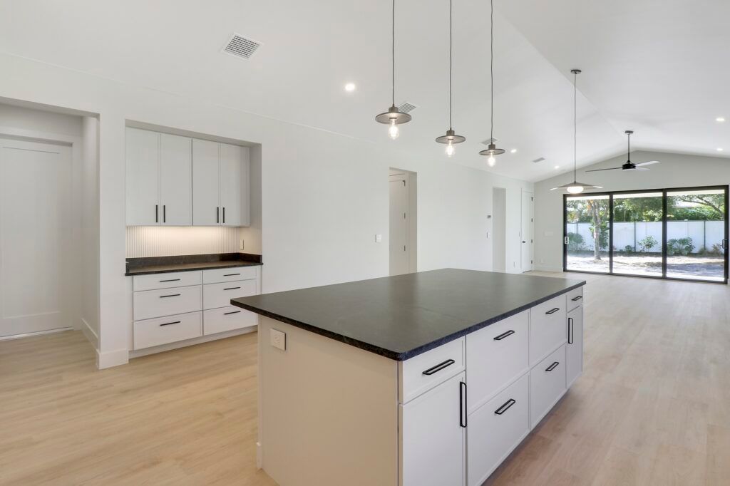 There is a large island in the middle of the kitchen.