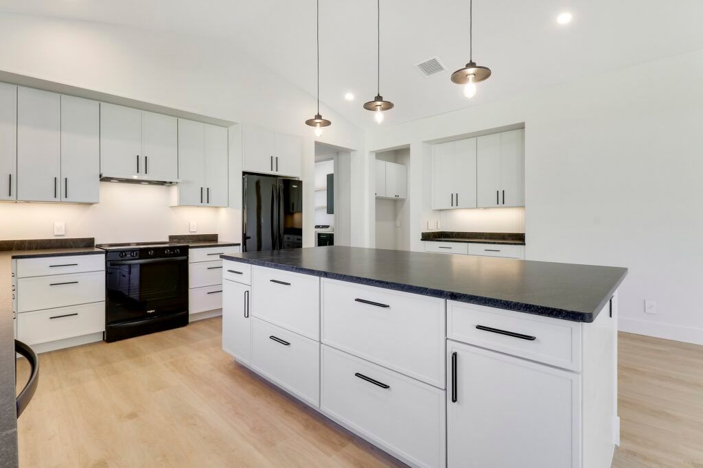There is a large island in the middle of the kitchen.