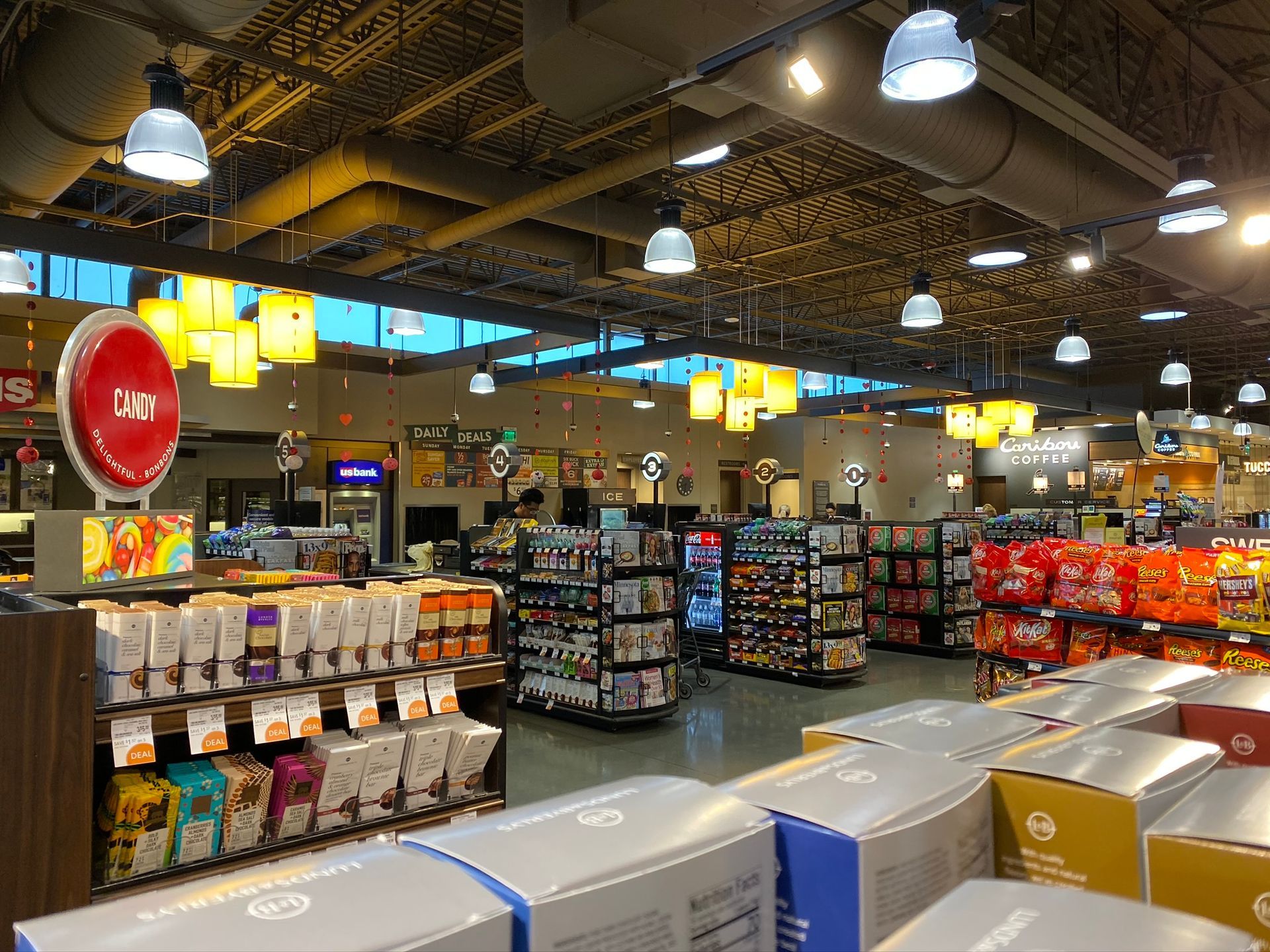 The inside of a grocery store with lots of shelves and boxes