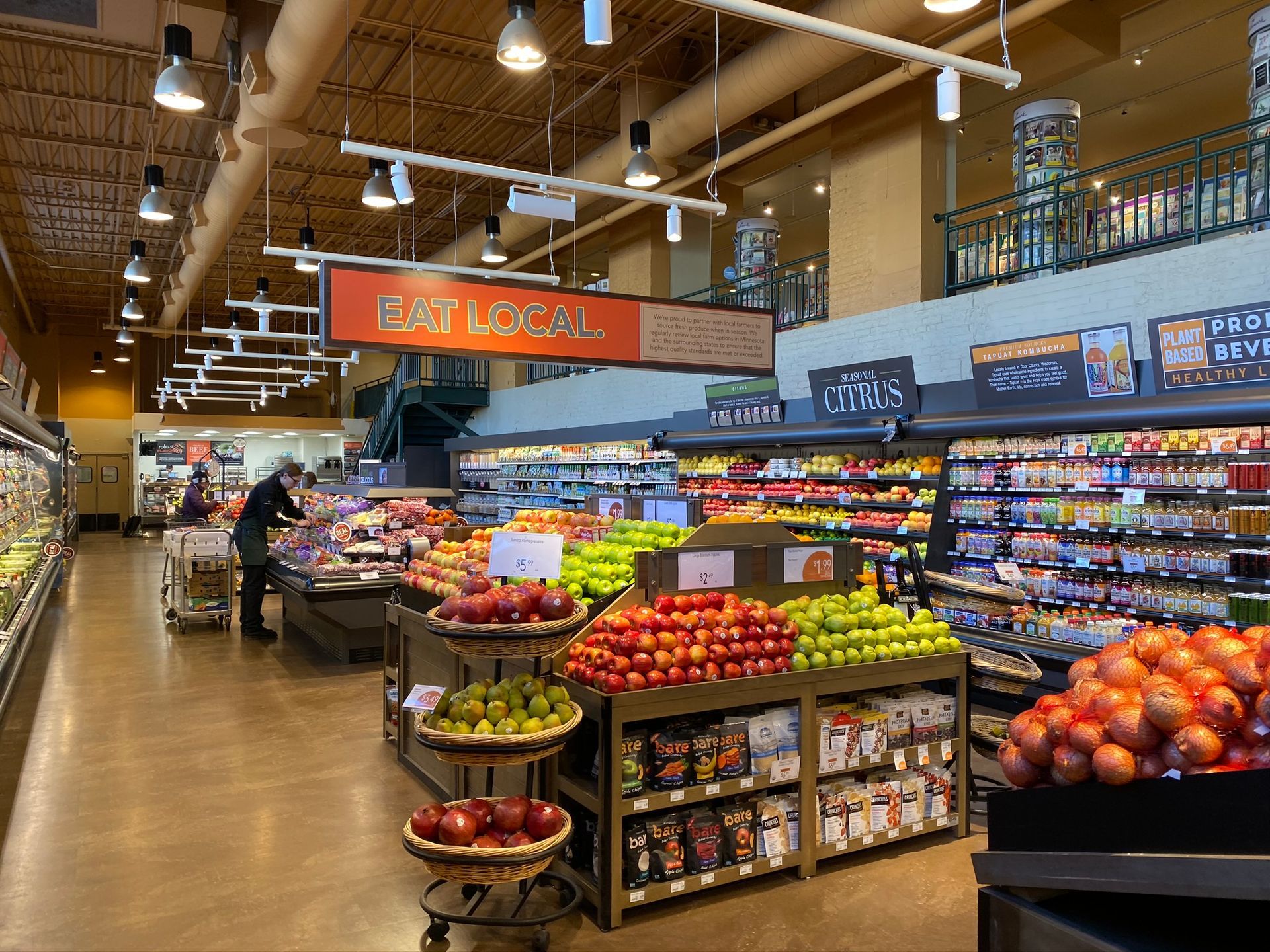 The inside of a grocery store filled with fruits and vegetables.