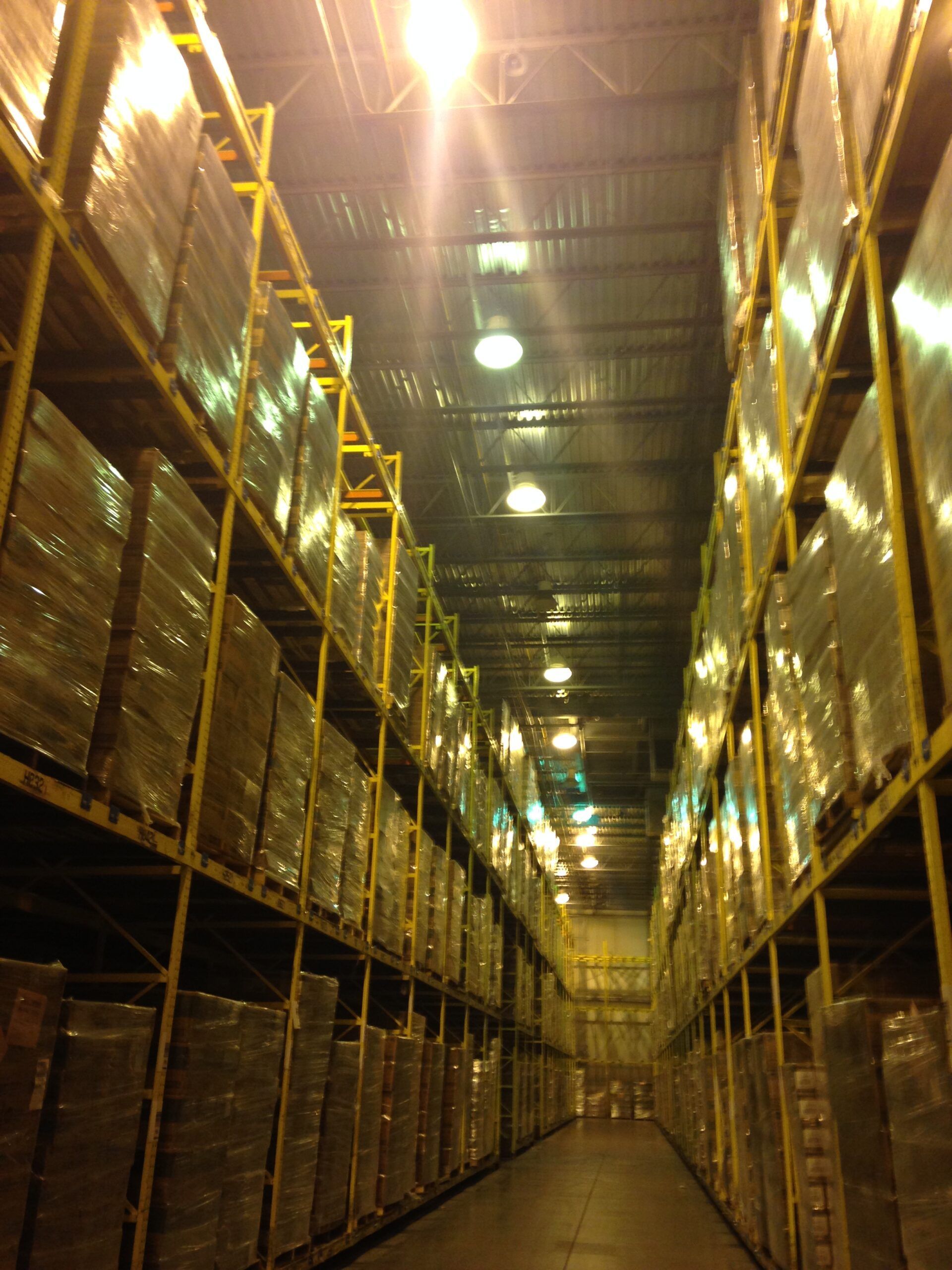 A warehouse filled with lots of boxes and shelves