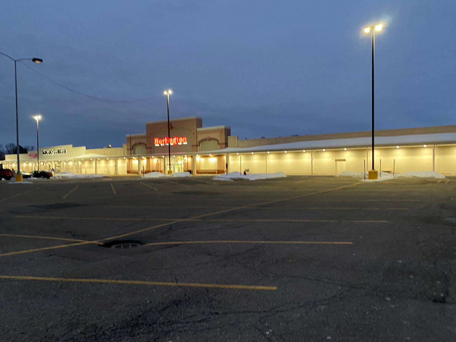 An empty parking lot in front of a walgreens store