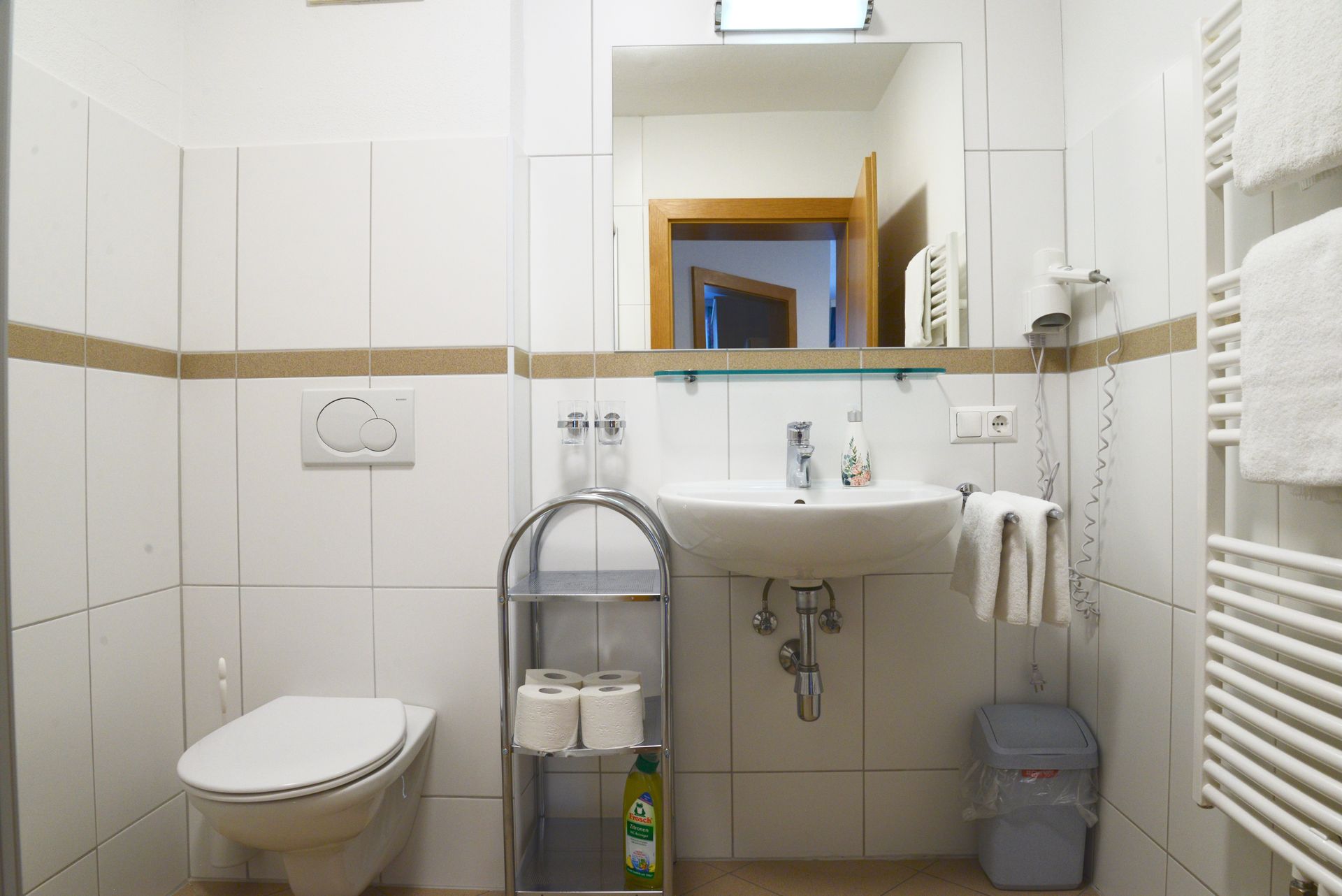 an suite bathroom with shower and toilet