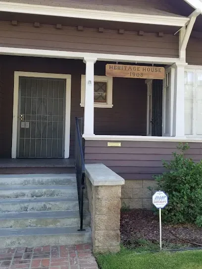 Tree Service El Monte Ca -Front view of a historic house with a 
