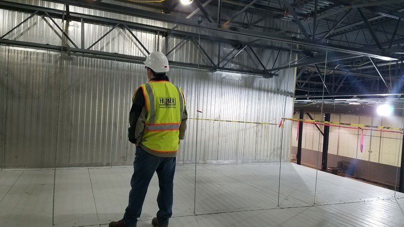 general contractor monitoring the construction