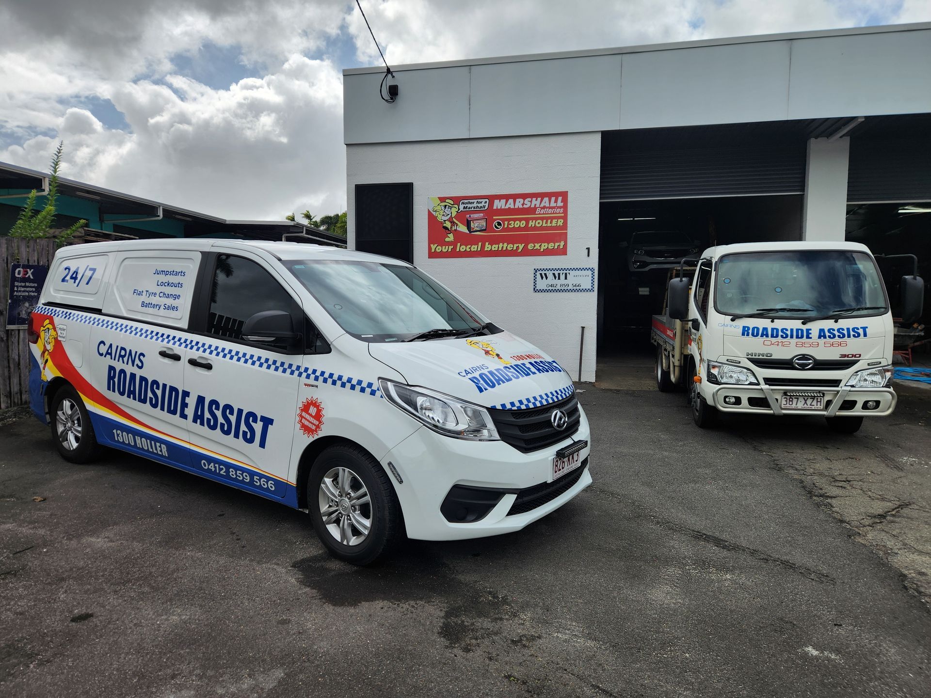Two Cars Are Connected To Each Other With Their Hoods Open — Cairns Roadside Assist In Cairns, QLD