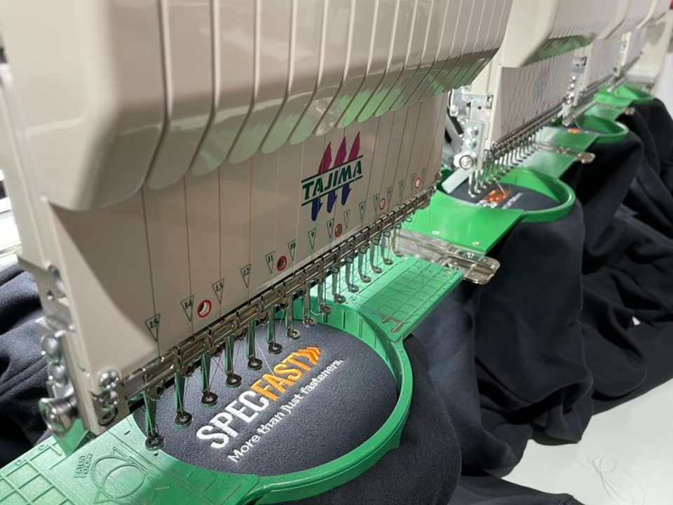 Embroidering t shirt using a machine for precise and intricate designs — Screen Printer in Dubbo, NSW