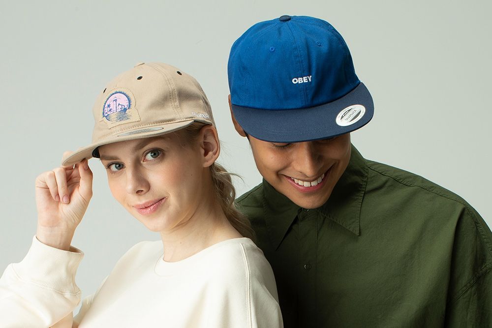 Two Individuals Wearing Caps, Showcasing a Stylish Accessory — Screen Printer in Dubbo, NSW