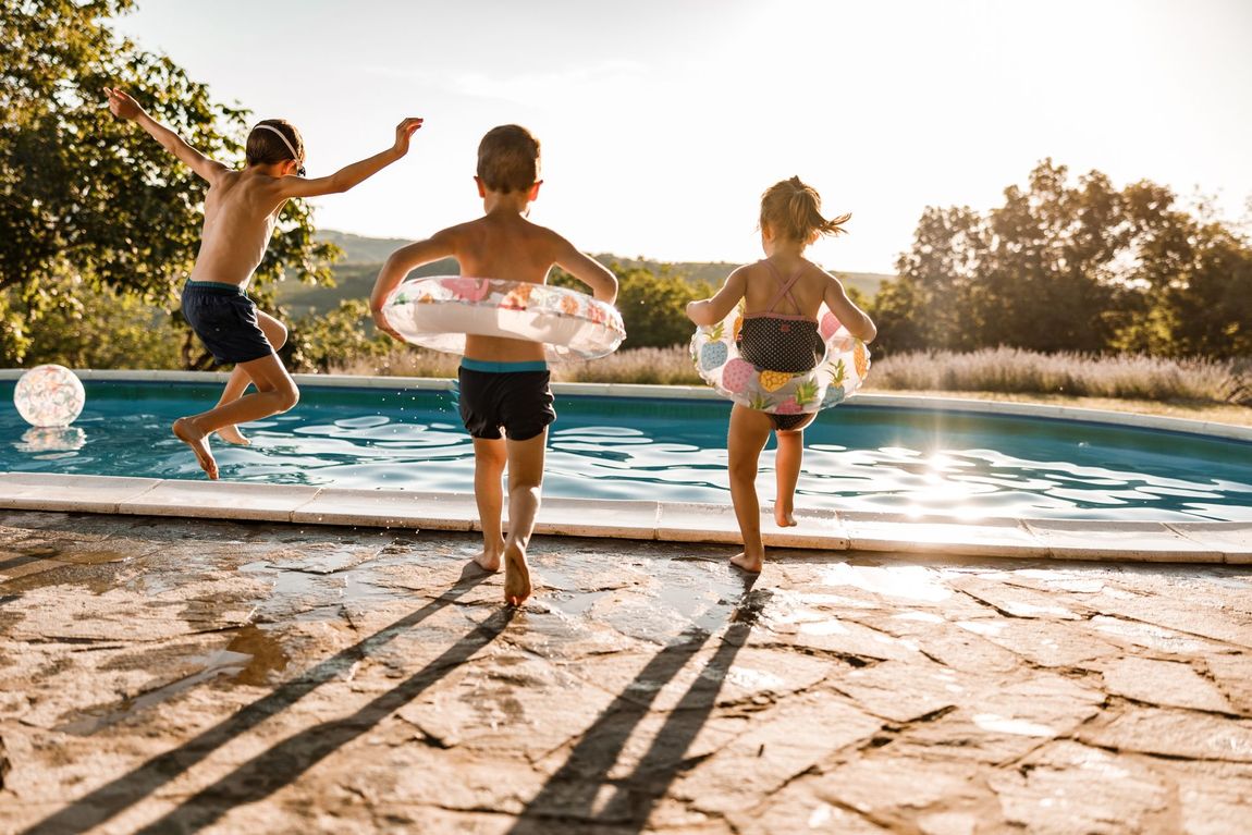 People jumping into pool