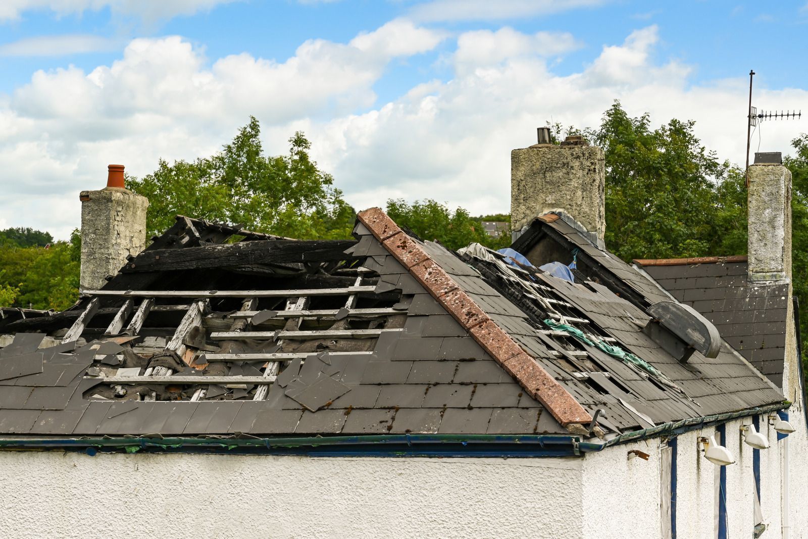 The roof of a house has been damaged by a fire.