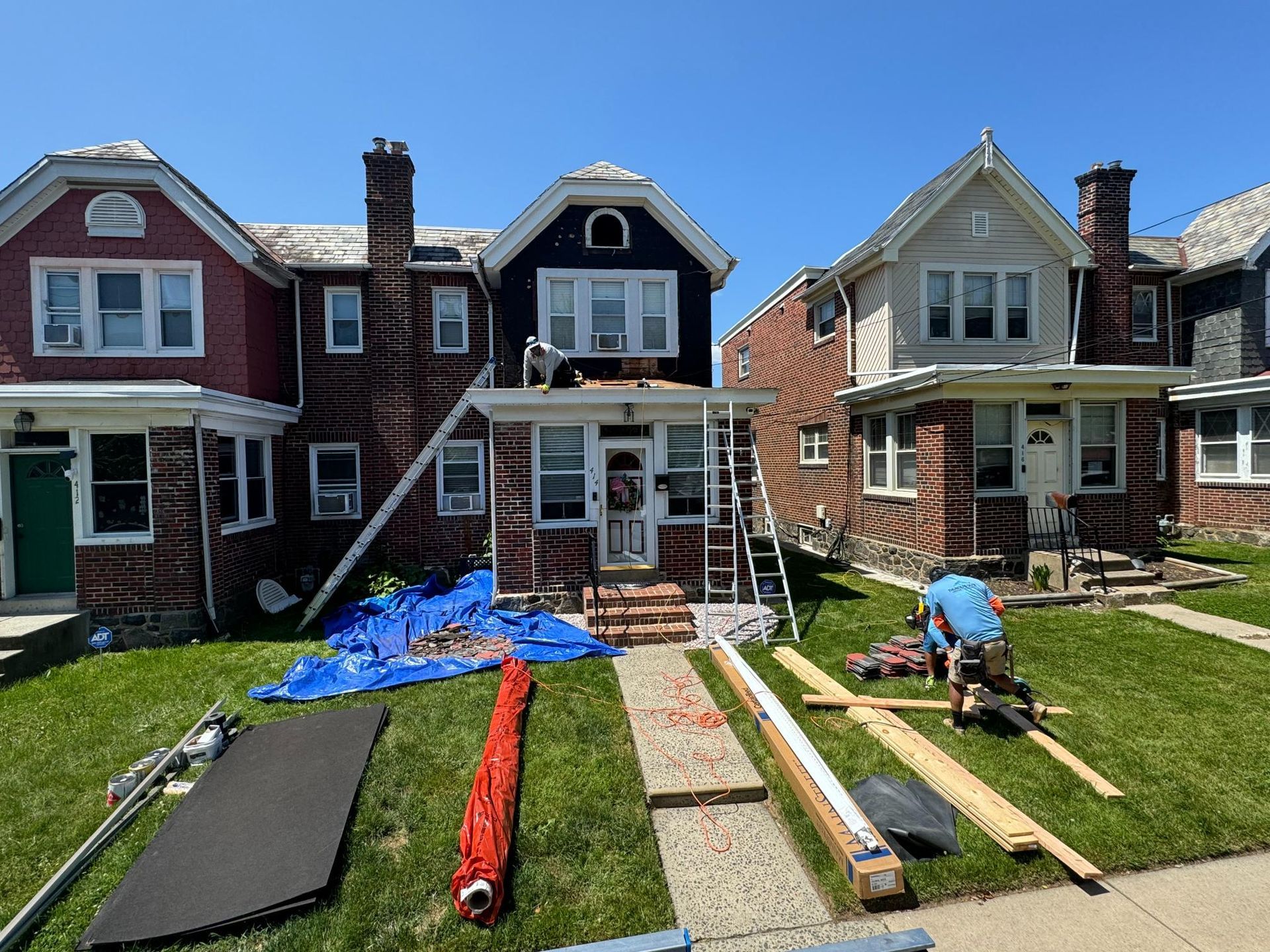 A row of houses are being remodeled in a residential neighborhood.