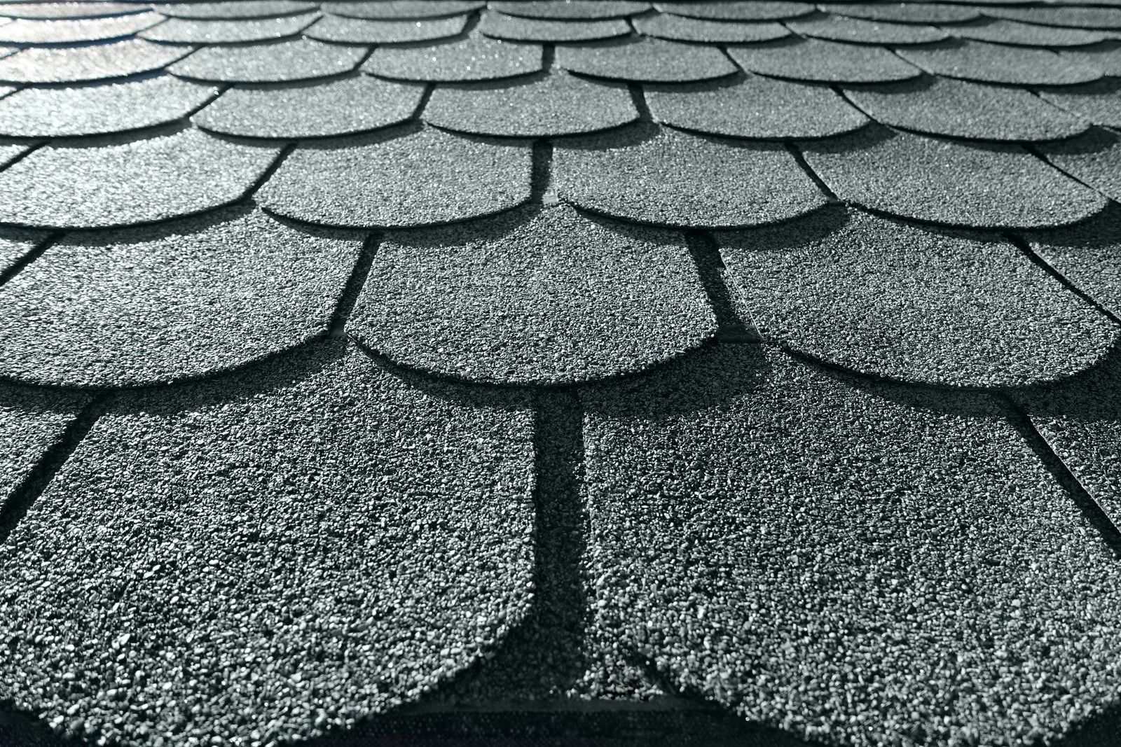 A close up of a roof with shingles on it