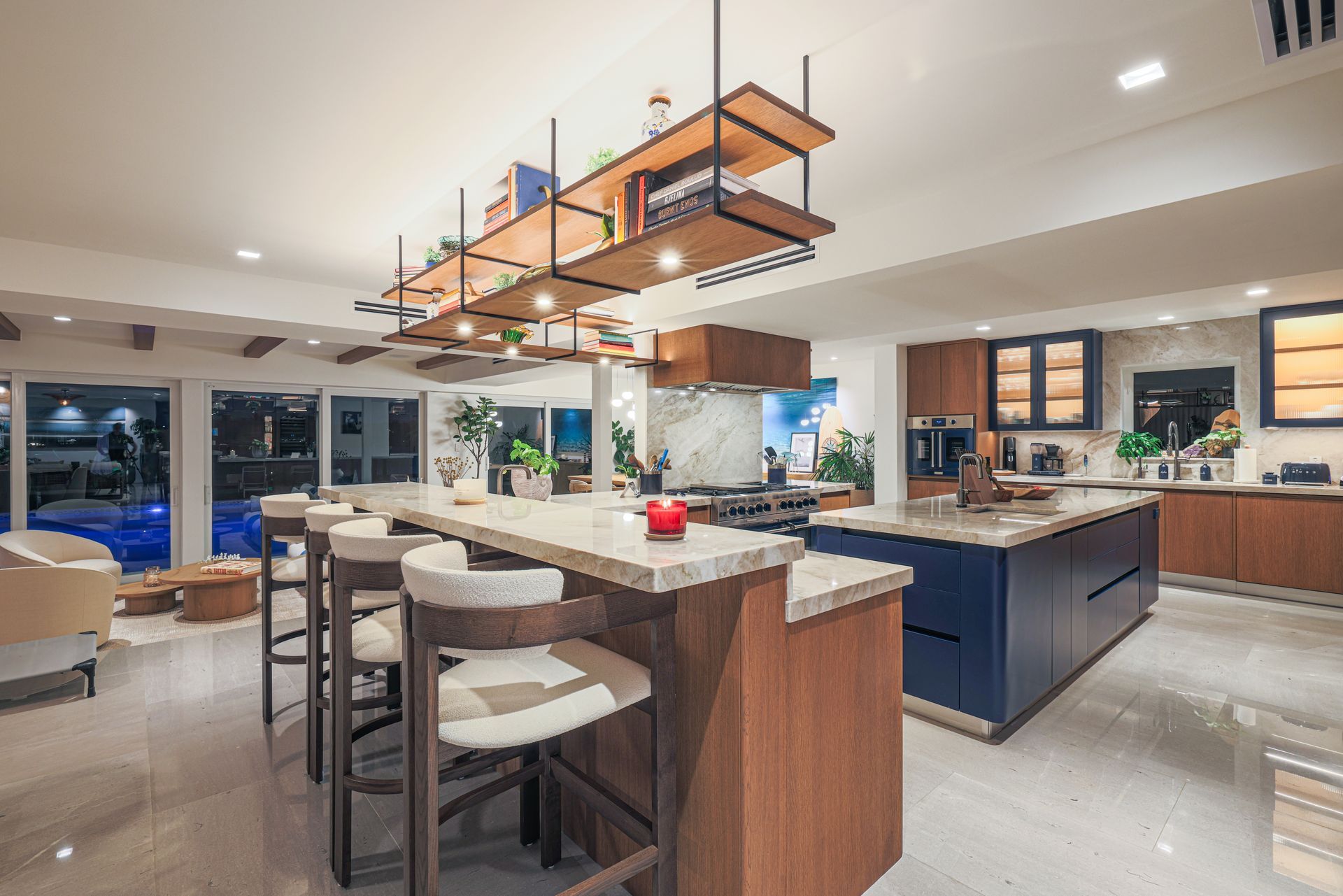 A large kitchen with a large island and stools.