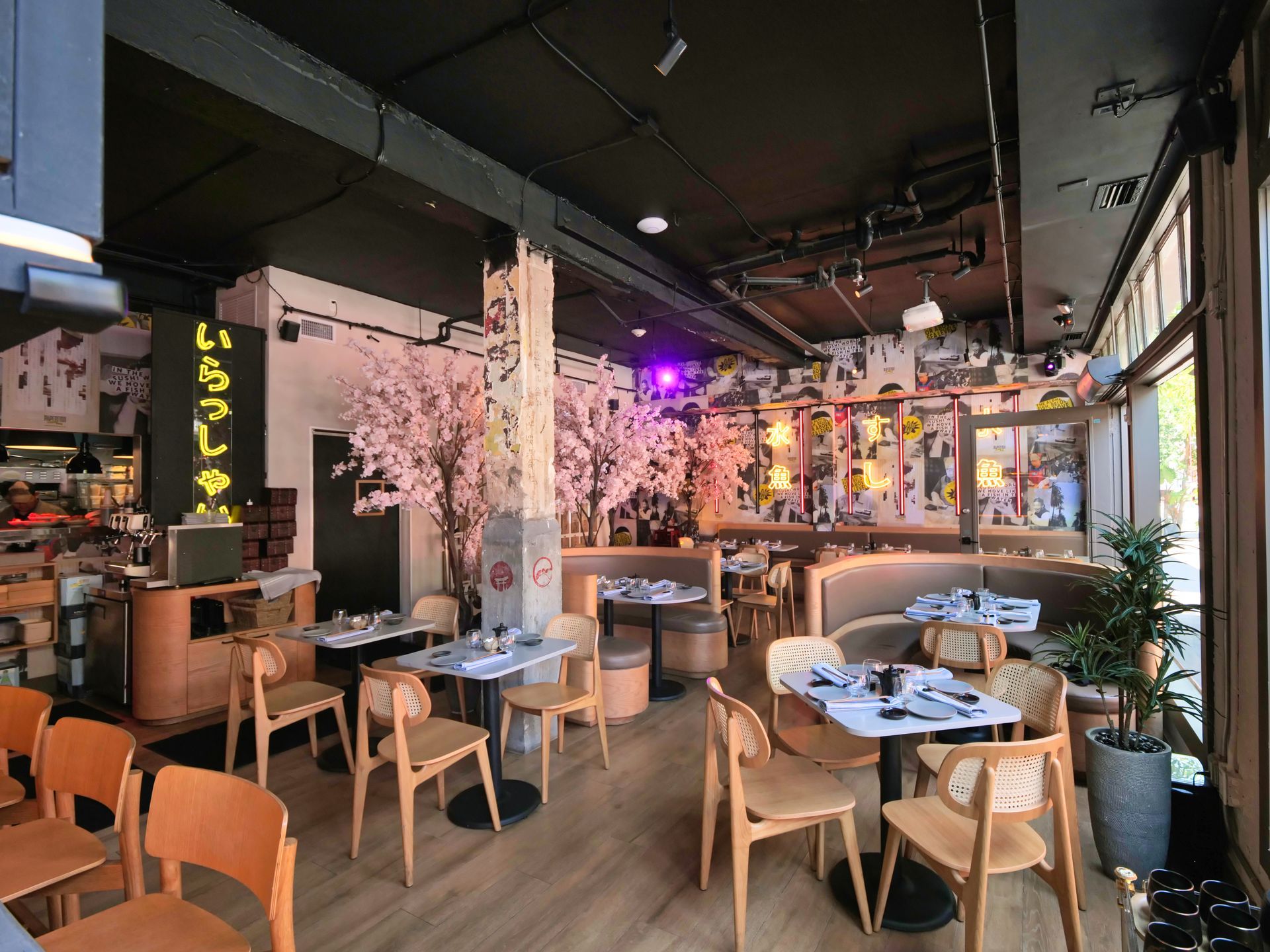 There are many tables and chairs in the restaurant.