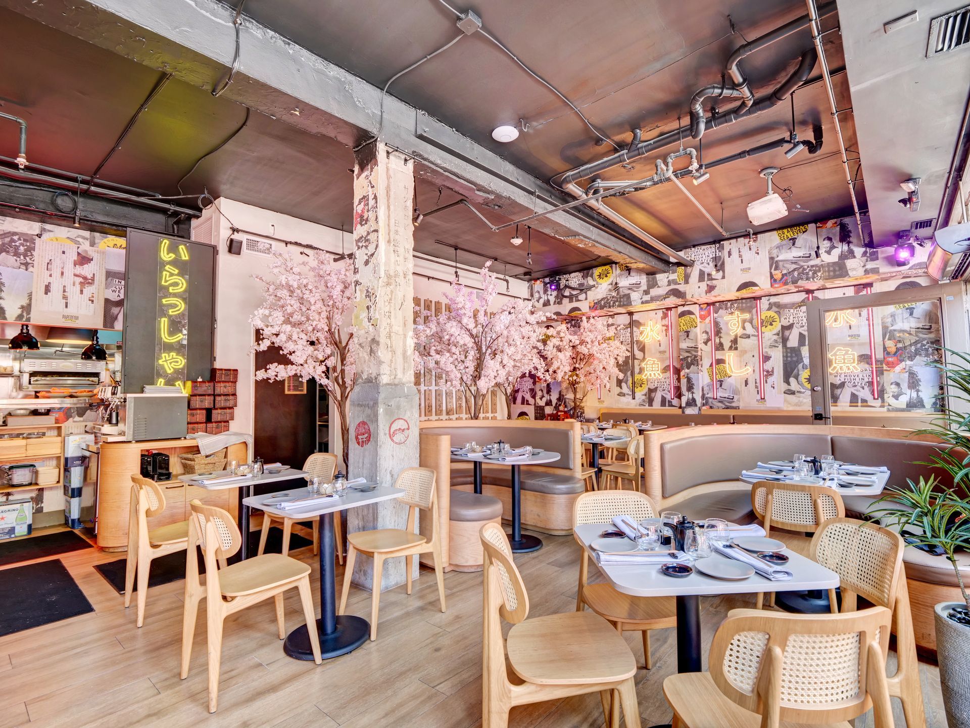 There are many tables and chairs in the restaurant.