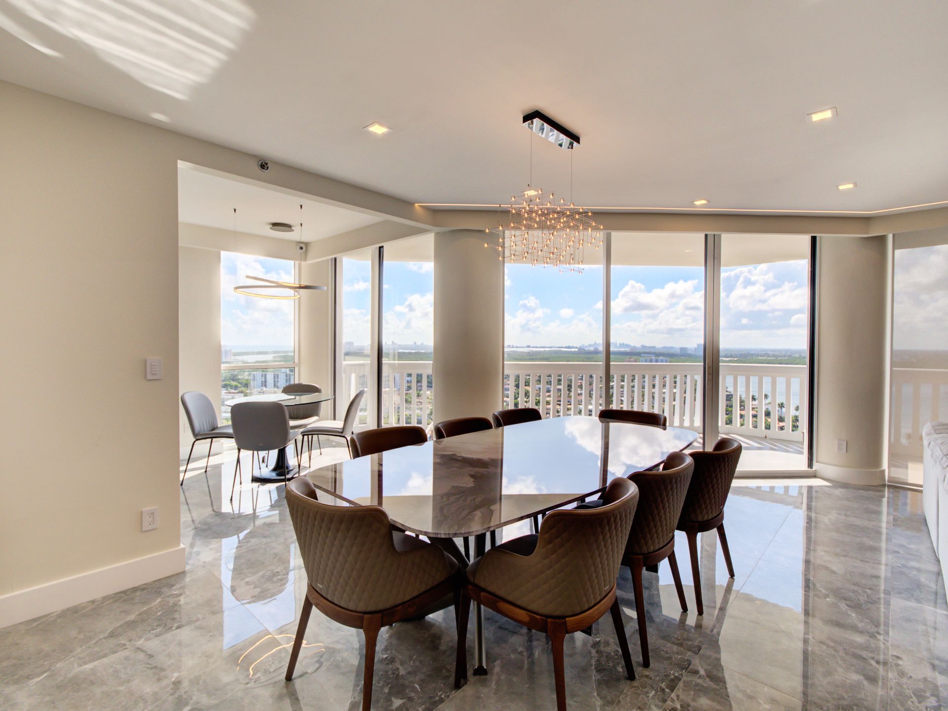 A large dining room with a large table and chairs