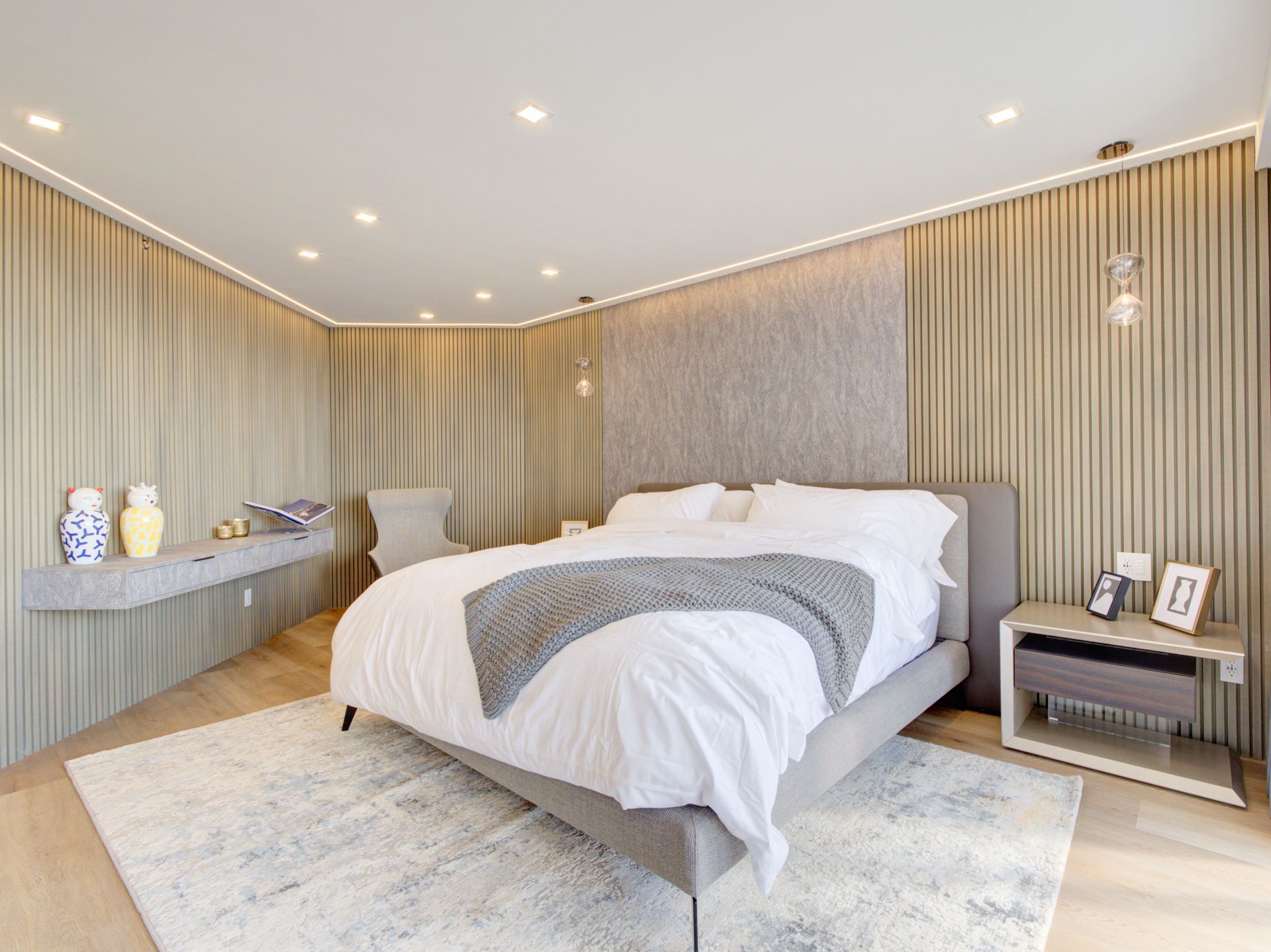 There is a large bed in the middle of the room.