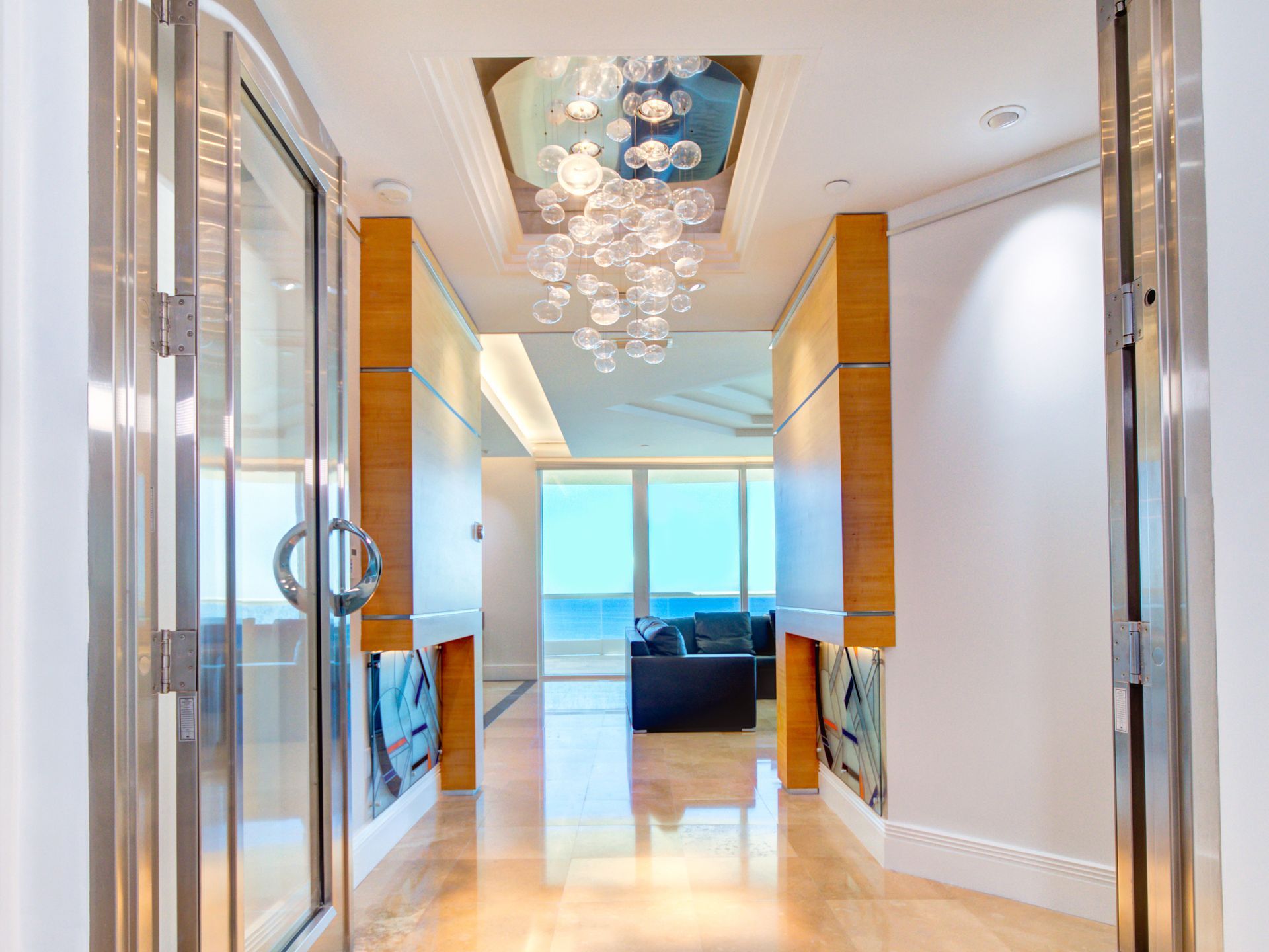 A hallway with a chandelier hanging from the ceiling