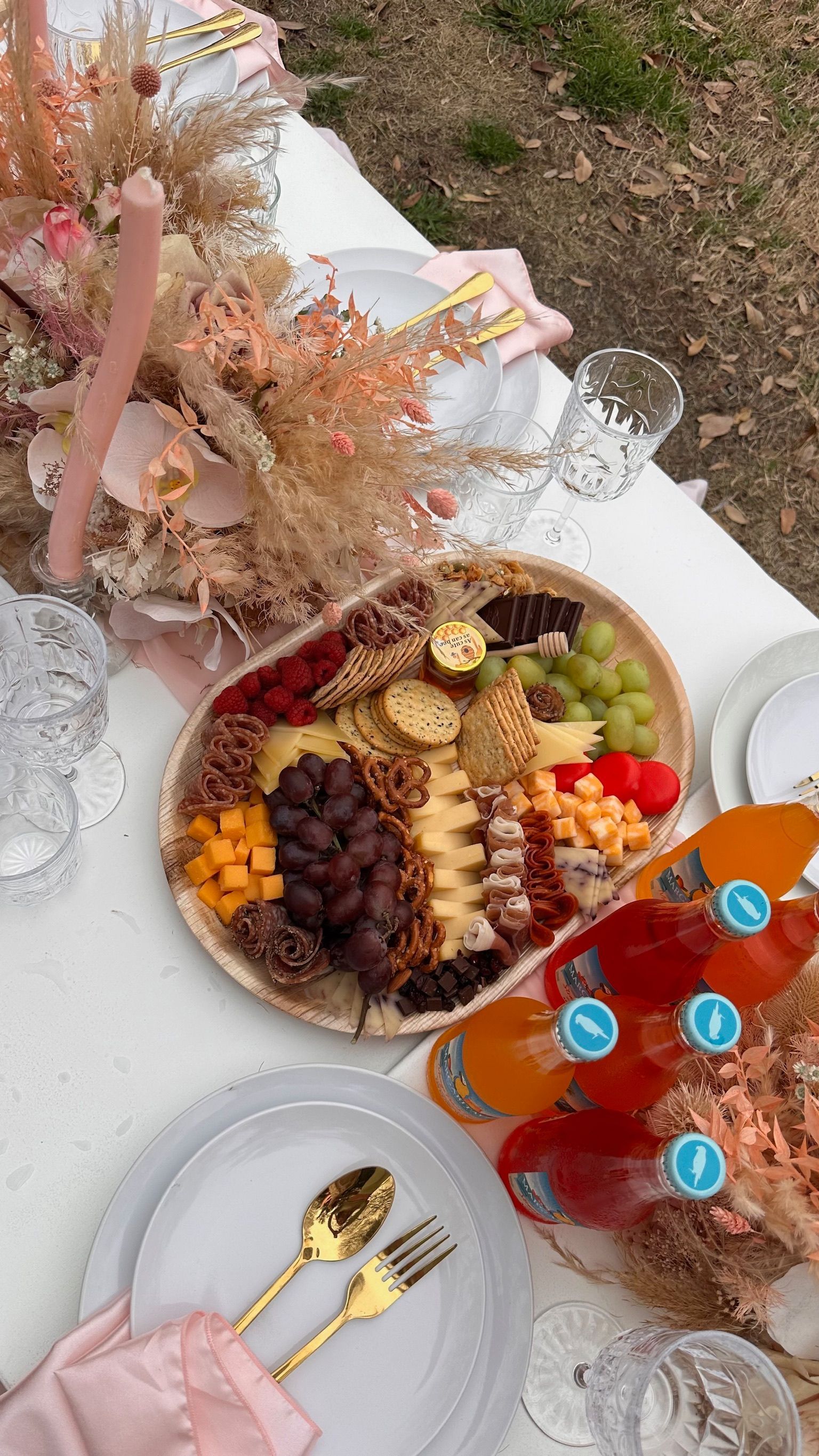 A large tray of fruits and vegetables on a table.