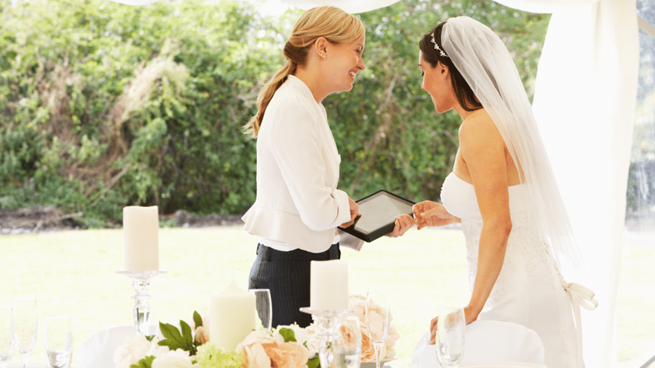 Bride talking to Wedding Coordinator