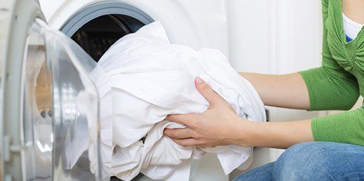Housekeeper with Washing Machine — Vent Cleaning in Egg Harbor Township, NJ
