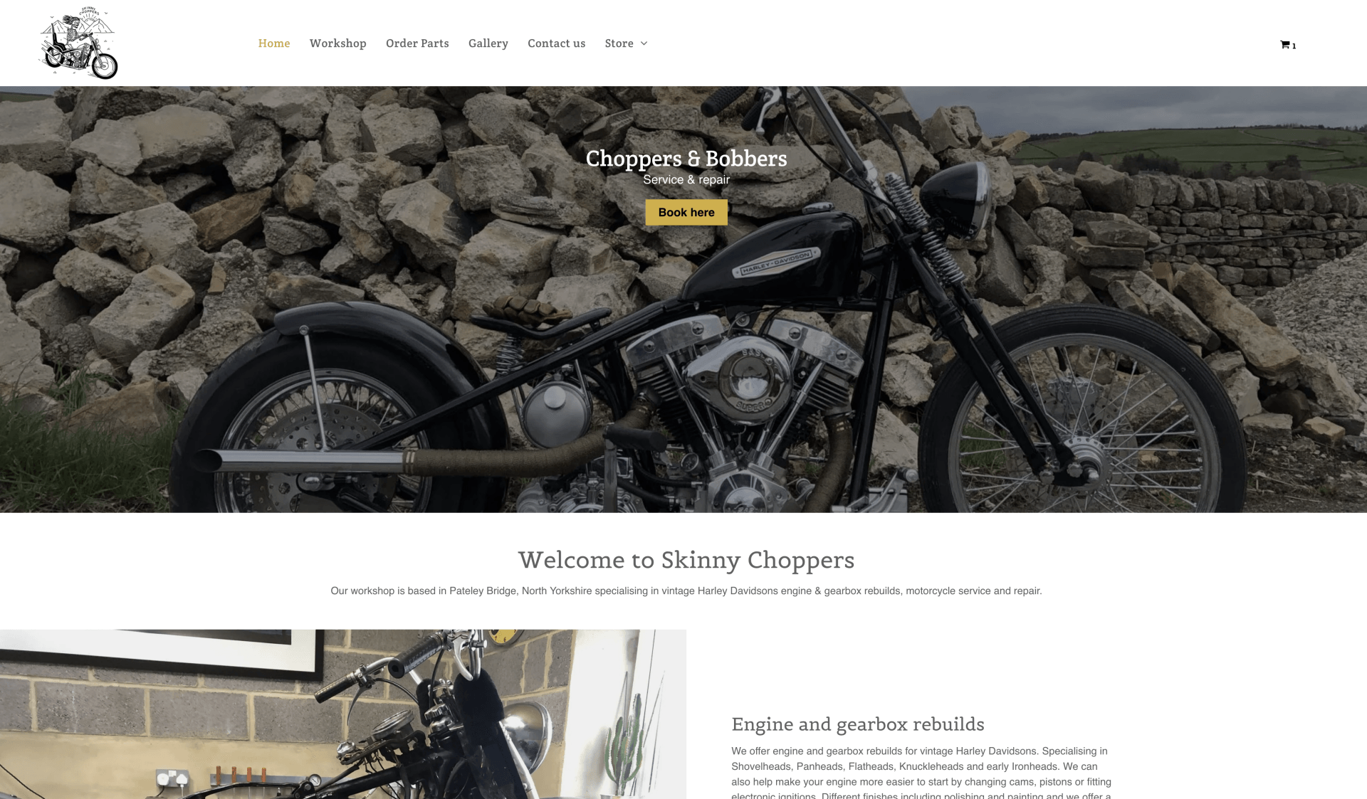 A motorcycle is parked in front of a pile of rocks on a website.