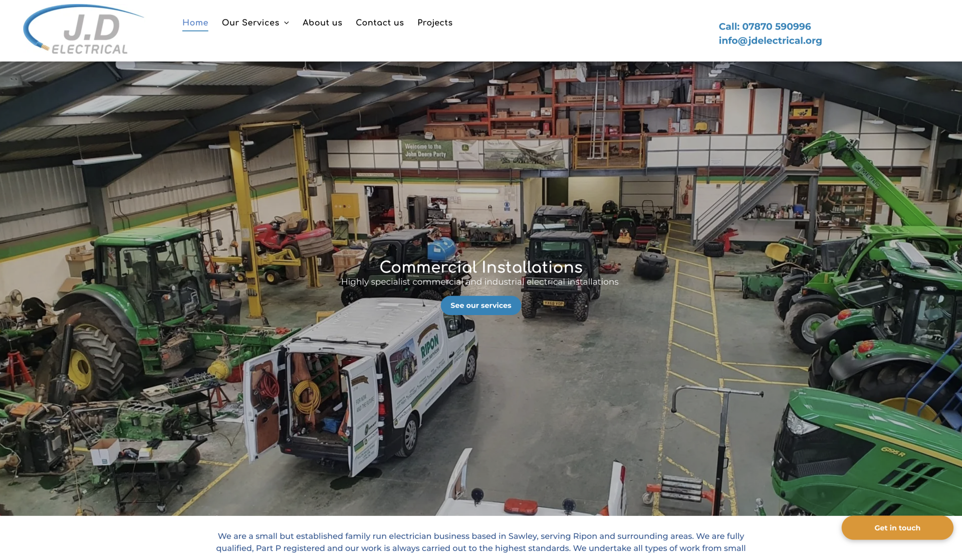 A screenshot of a website showing a warehouse filled with tractors and a van.