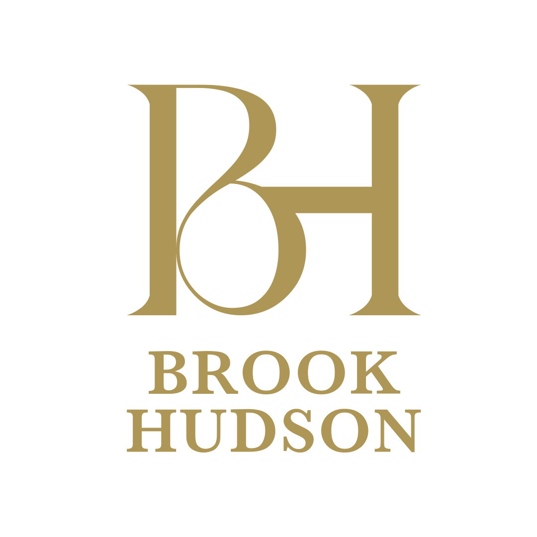 Gold monogram “BH” logo with 