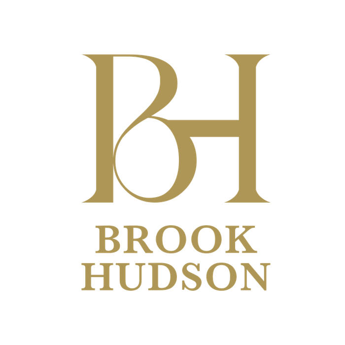 Gold monogram “BH” logo with 