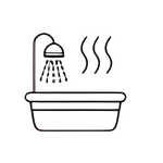 Bathtub with showerhead and steam rising.