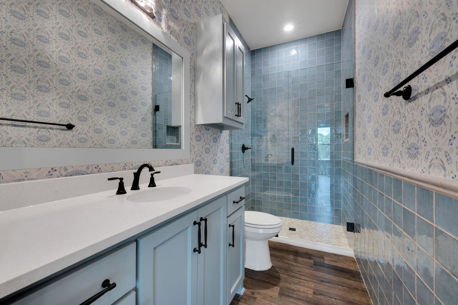 bathroom remodel with walk-in shower and tile walls