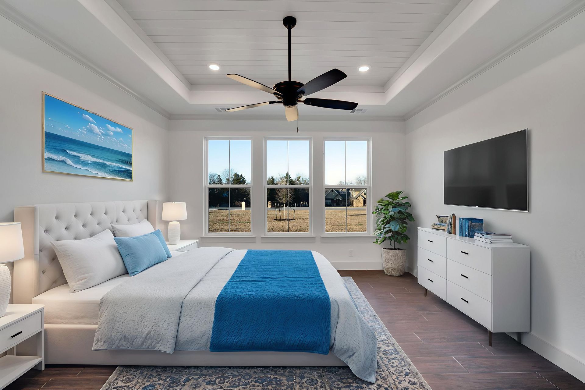 modern bedroom with tray ceiling and large windows