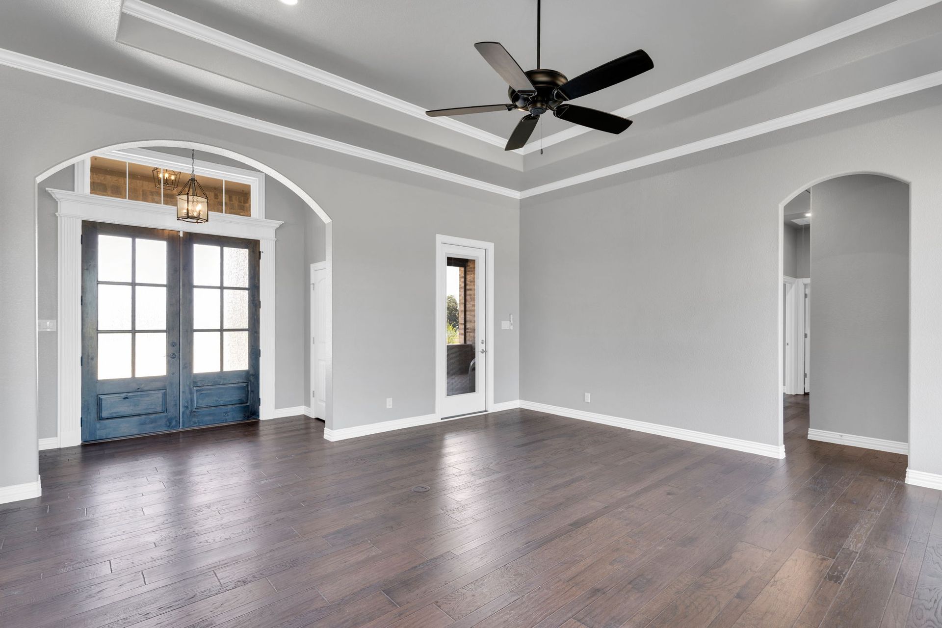 home entryway with chandelier and front door