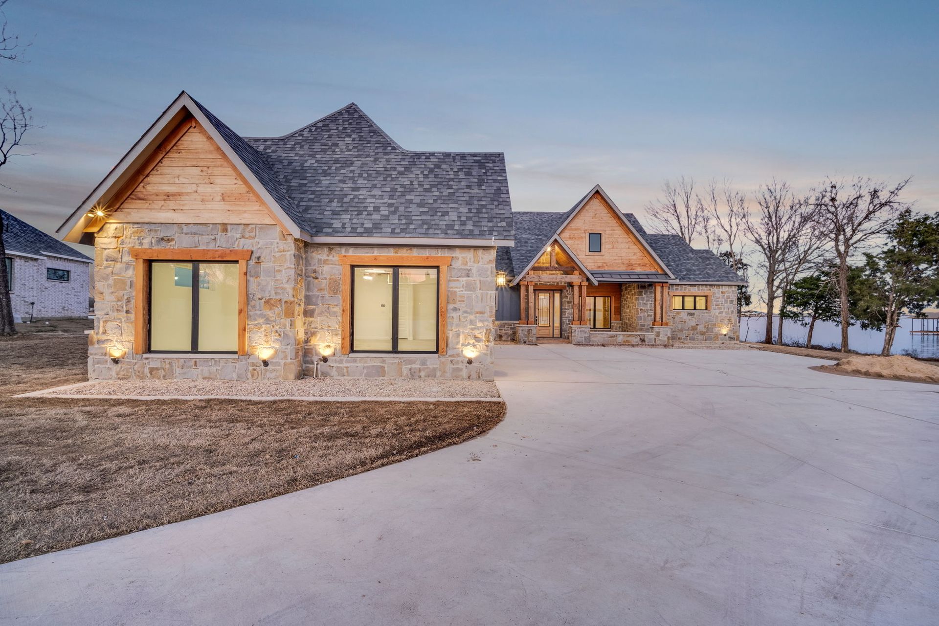 custom home exterior with stone and wood accents