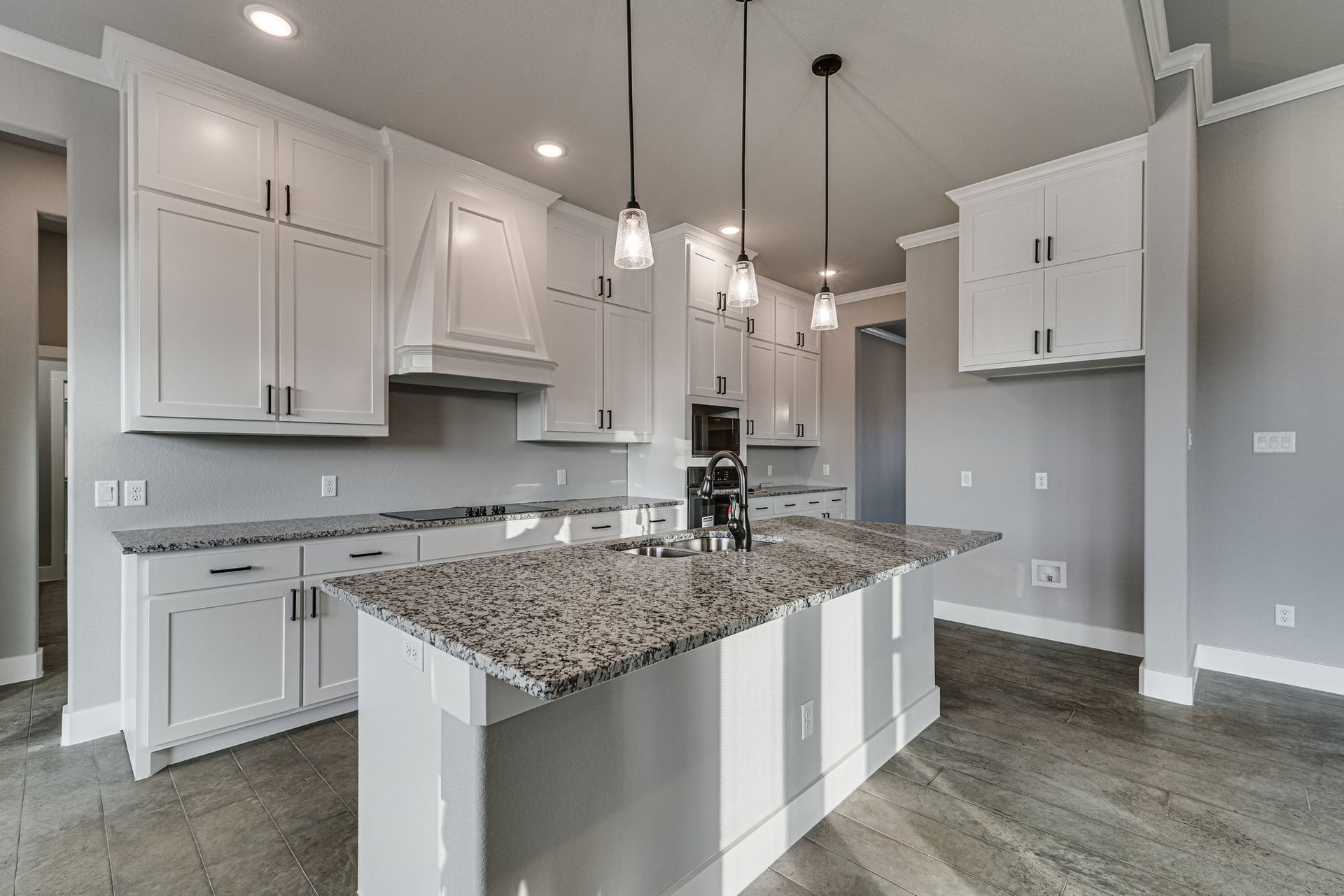 modern kitchen with island and white cabinetry