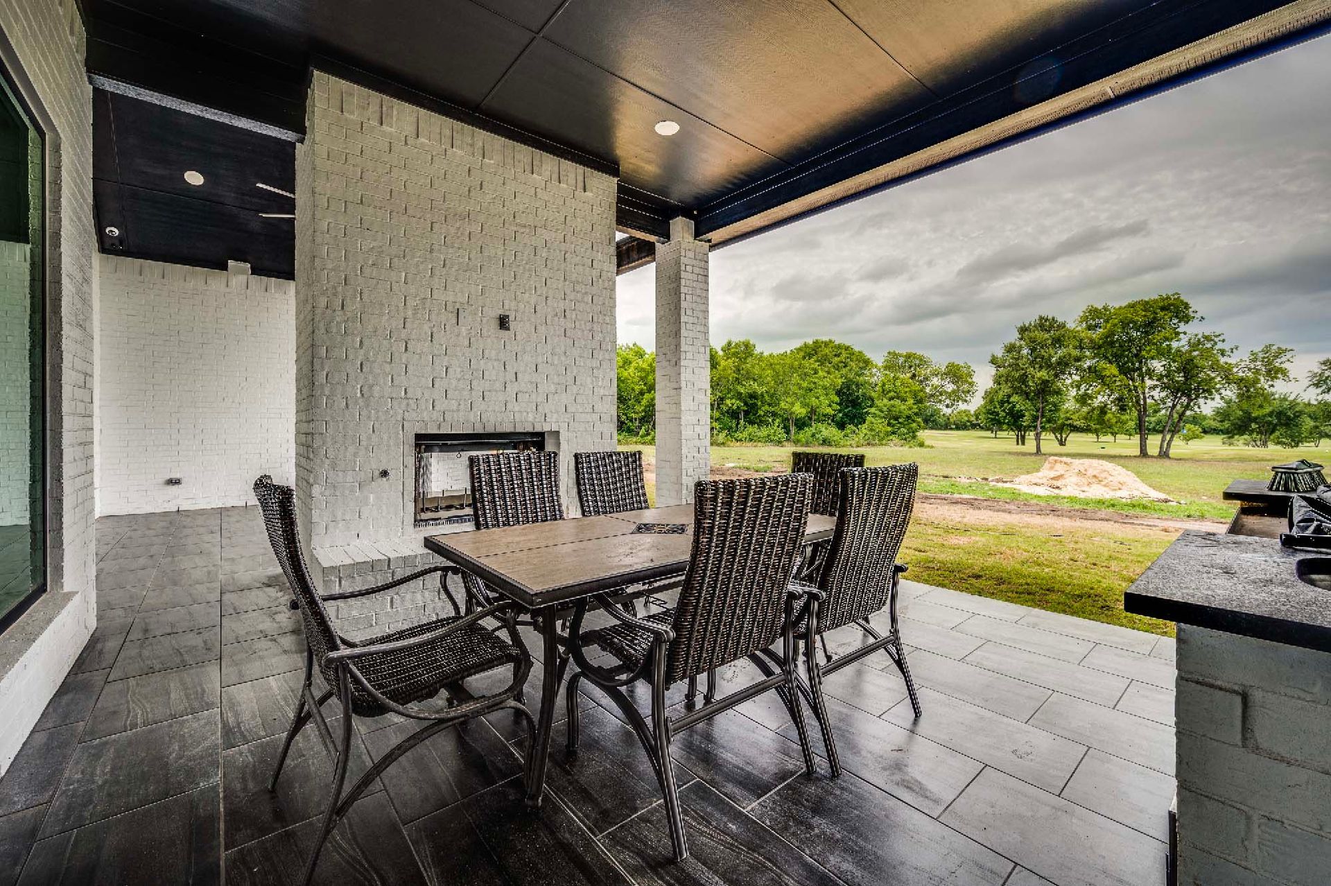 outdoor patio with seating area and backyard view