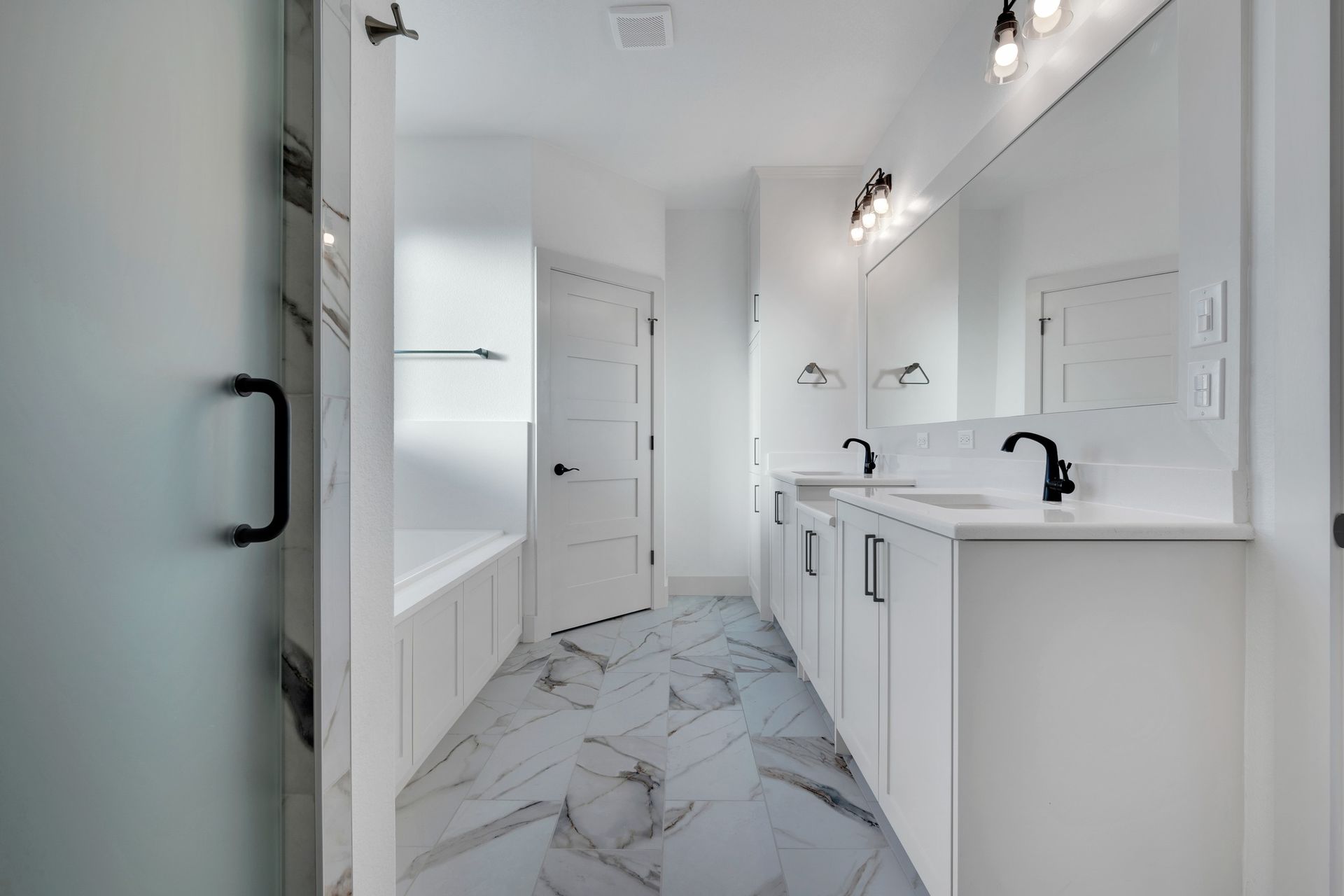 modern bathroom remodel with double vanity and shower

